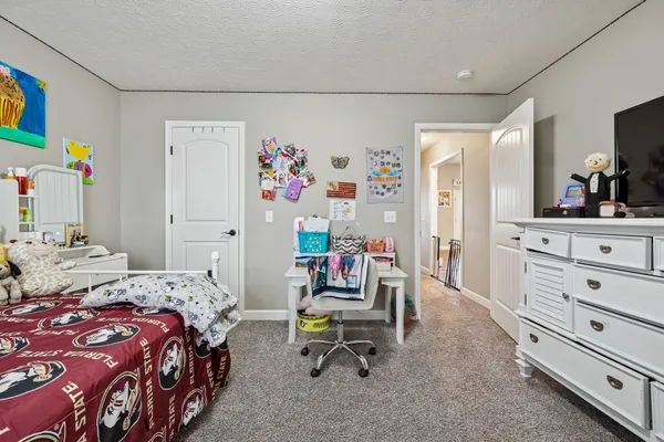 a bedroom with a bed and furniture