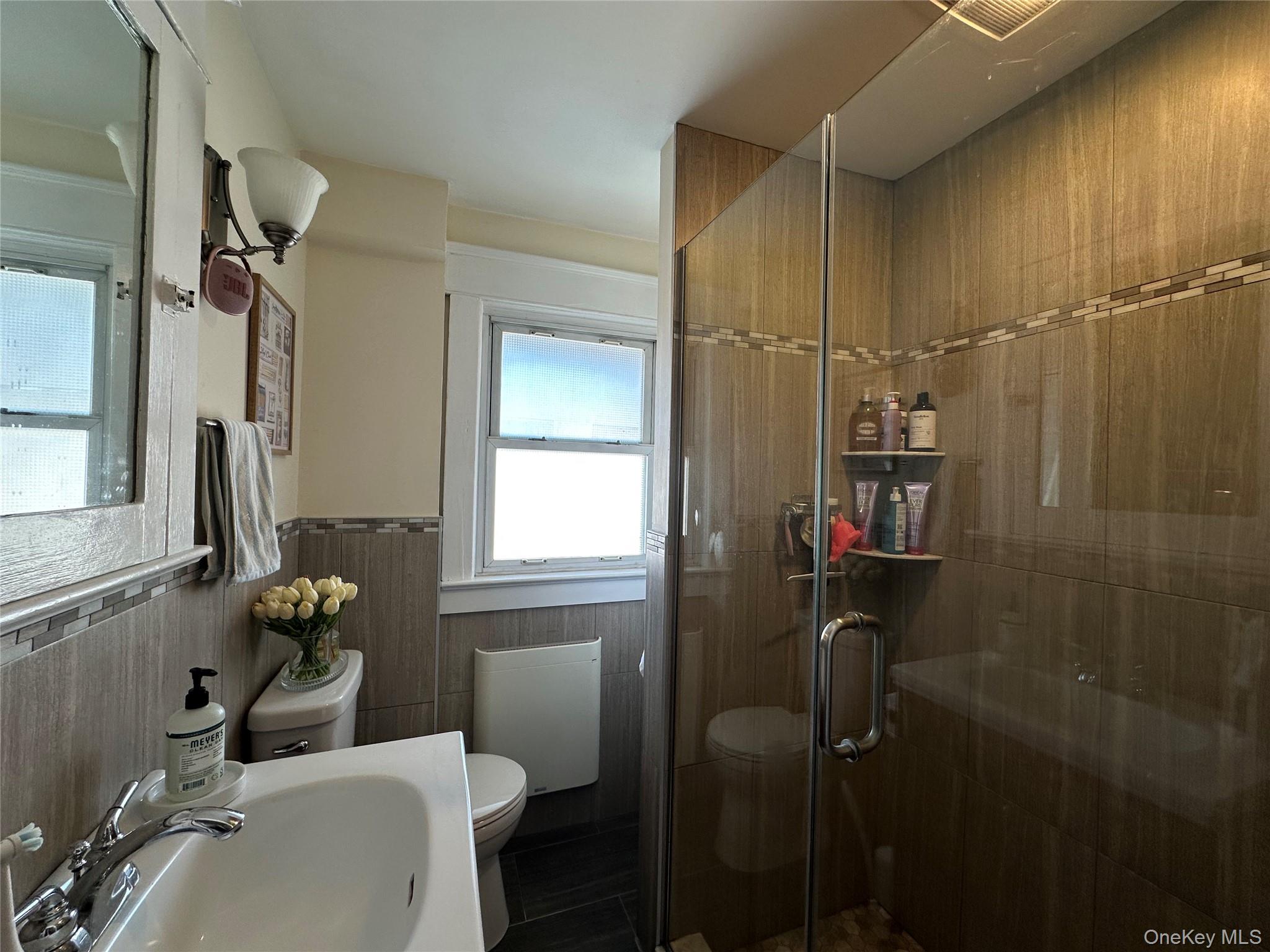 5 Fairmount Street, Unit 3 Huntington, NY 11743 - Photo 3 of 6 Bathroom with Glass Shower Doors