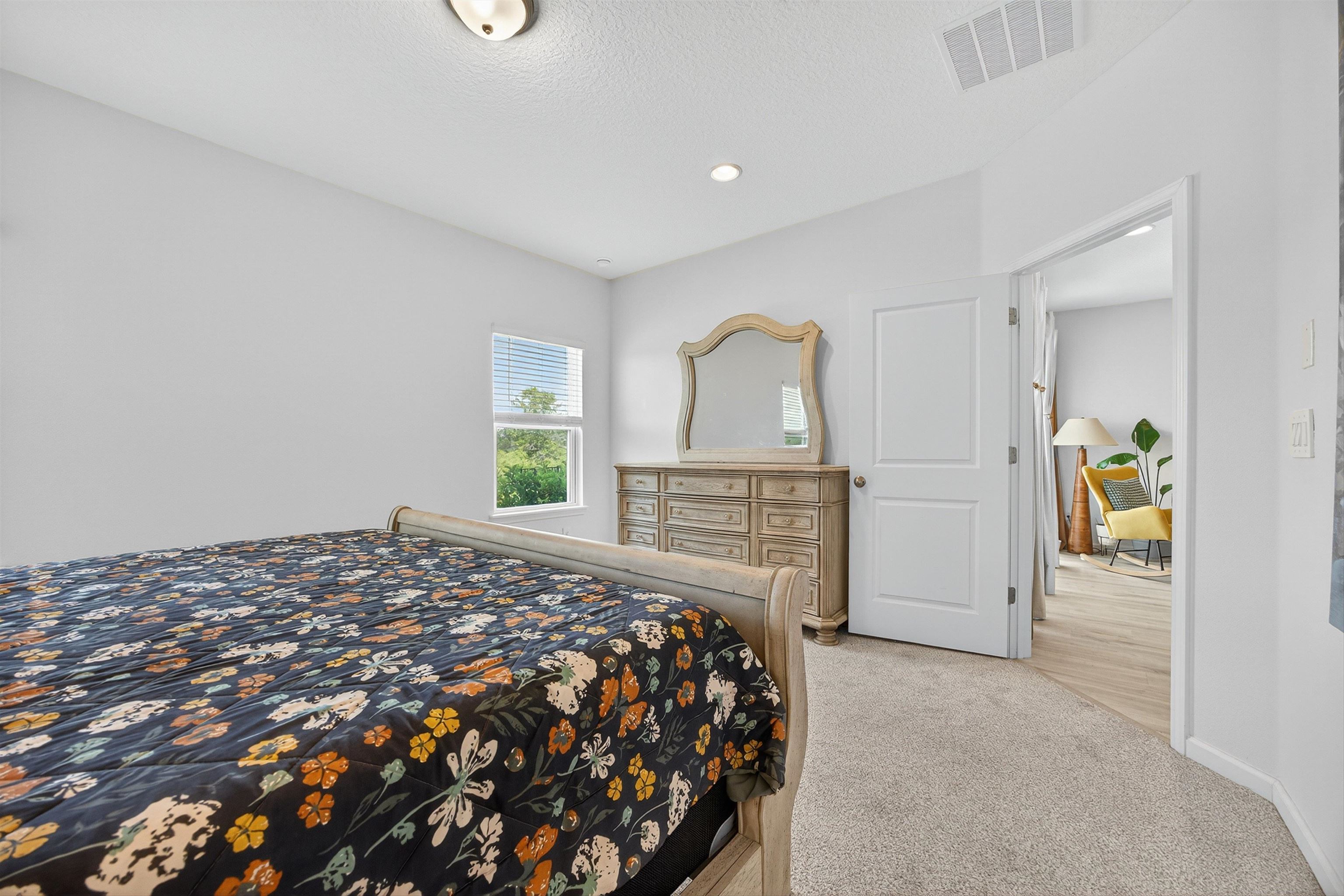 168 Torres Trace St. Augustine, FL 32095 - Photo 15 of 51 a bedroom with a bed and a dresser