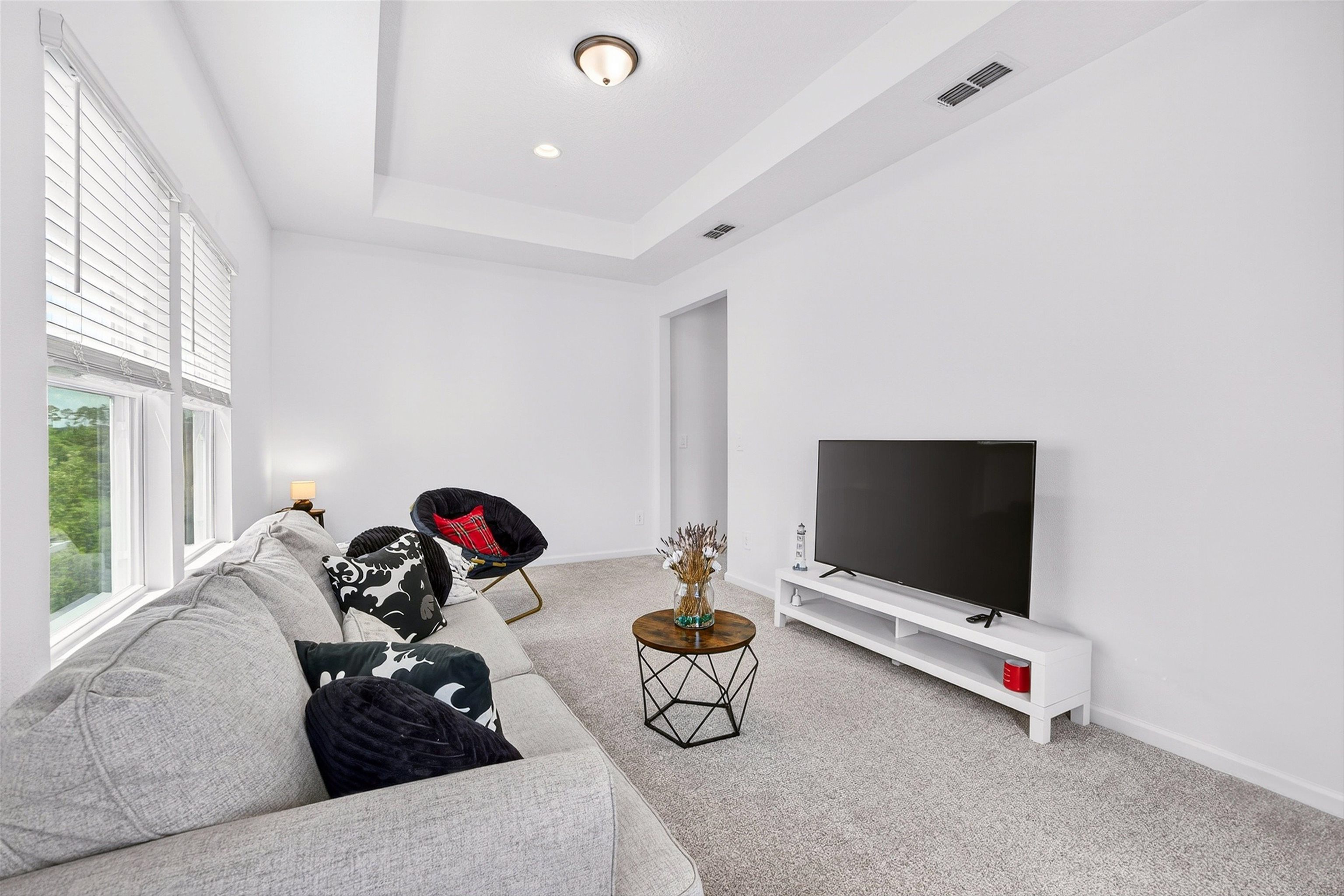 168 Torres Trace St. Augustine, FL 32095 - Photo 20 of 51 a room with gym equipment and a flat screen tv