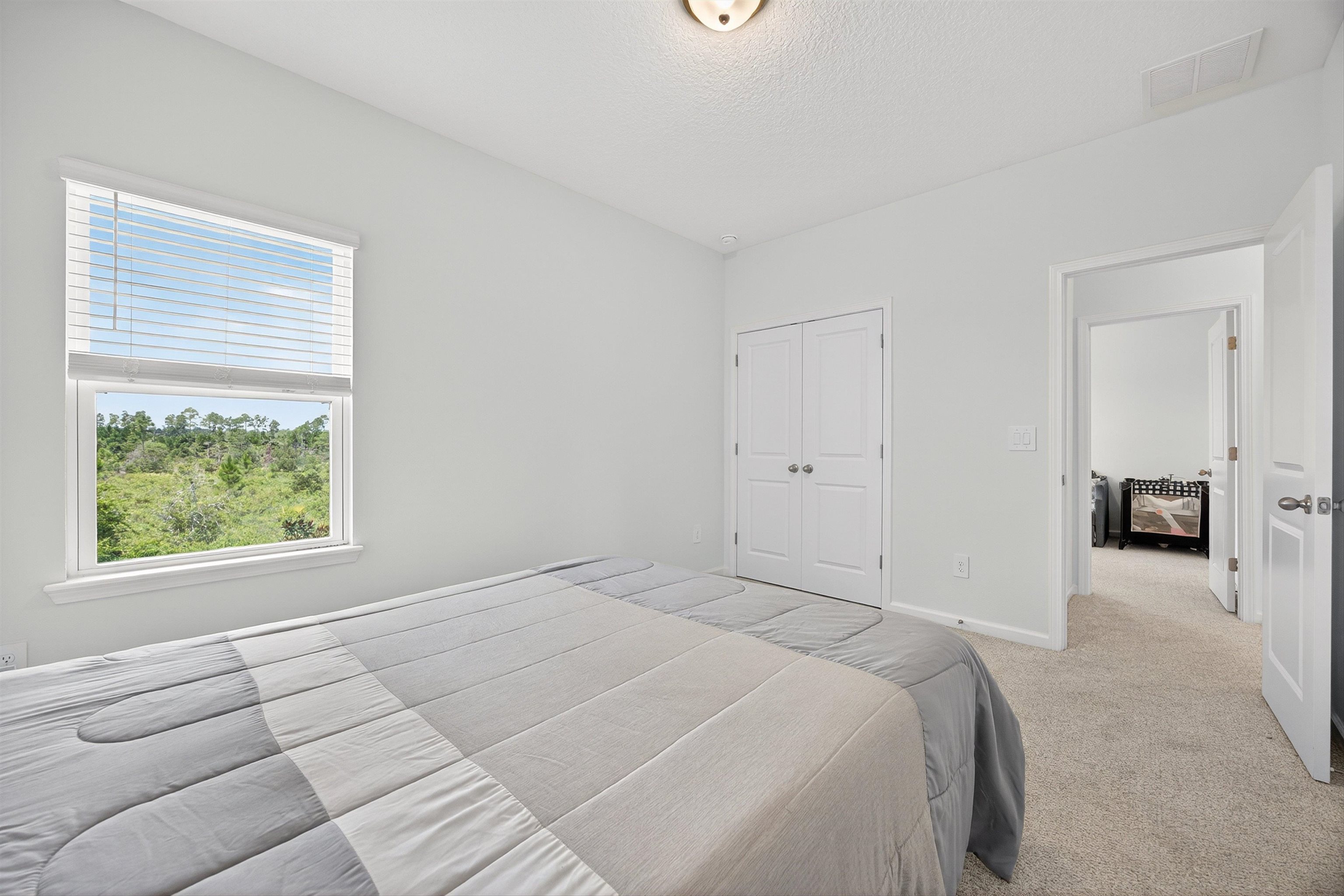 168 Torres Trace St. Augustine, FL 32095 - Photo 25 of 51 a bedroom with a bed and a window
