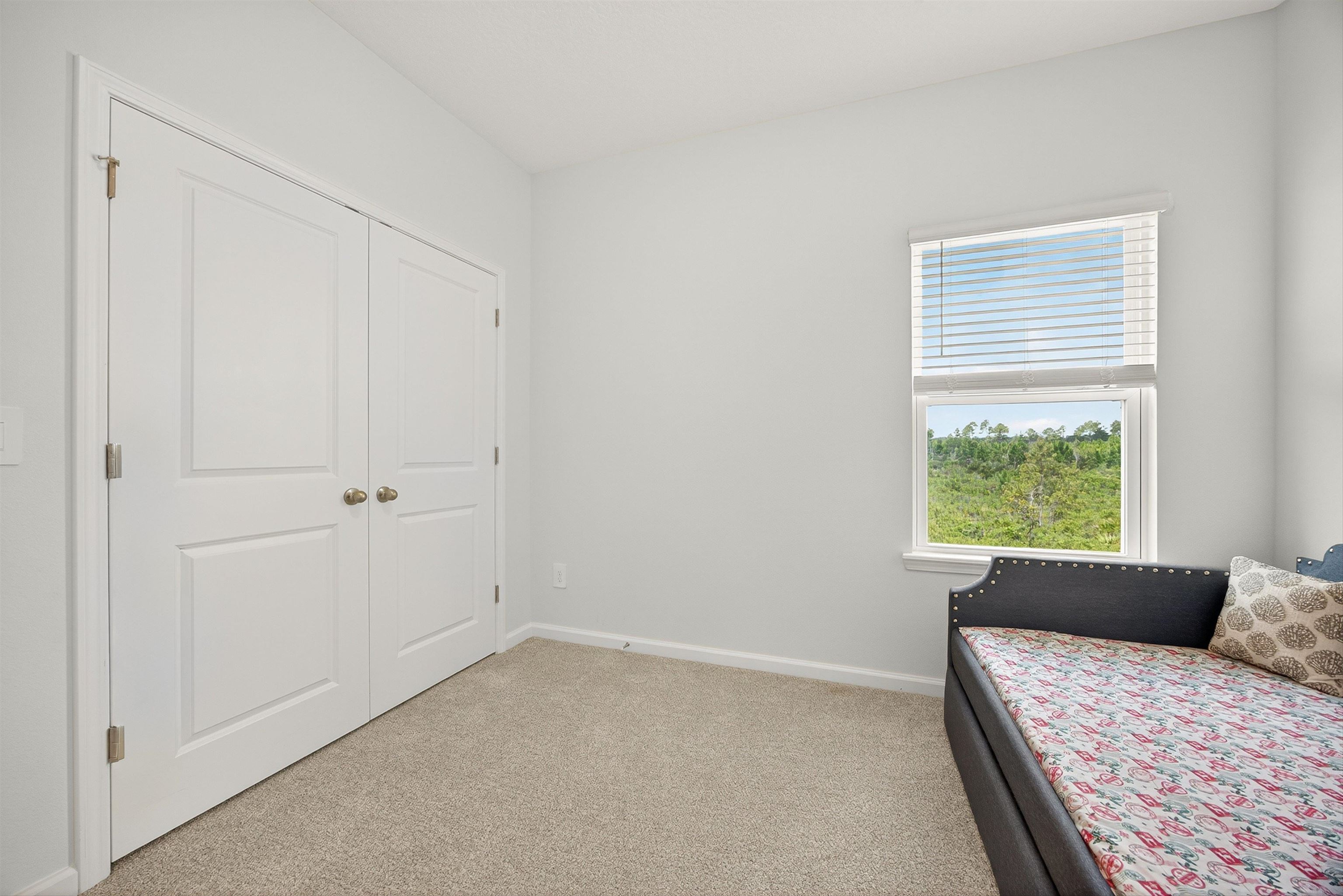 168 Torres Trace St. Augustine, FL 32095 - Photo 27 of 51 a room with a bed and a window