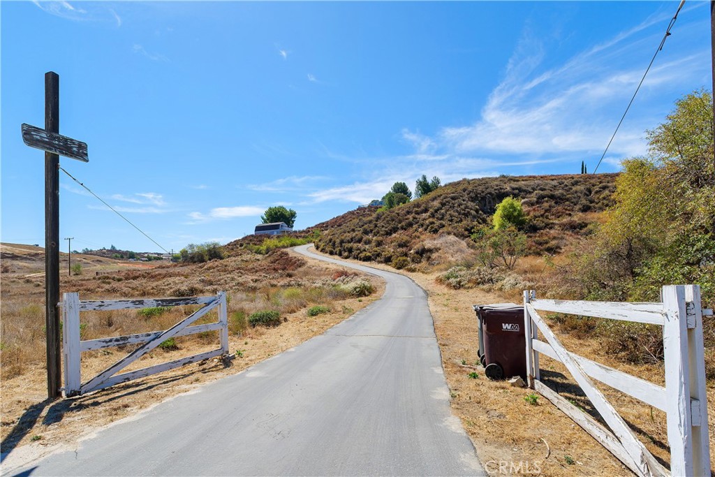 34881 Los Nogales Road Temecula, CA 92592 - Photo 50 of 50 Gated entry with paved driveway to the barn/workshop and the single story home.