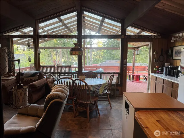 a very nice looking room with a large window and furniture