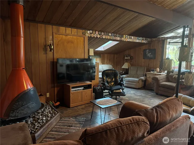 a bathroom with a sink a toilet and shower curtain