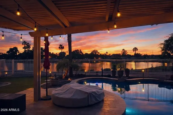 a view of a backyard with plants and a patio