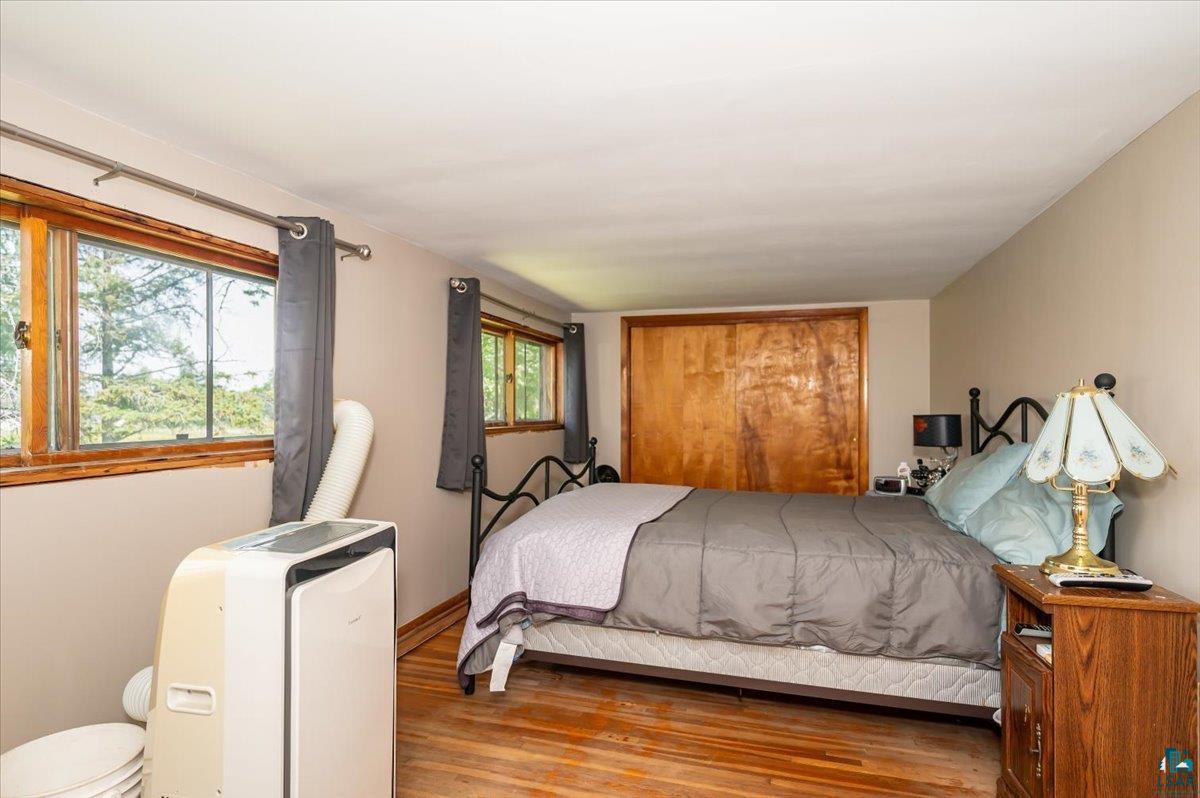 4367 South County Rd K South Range, WI 54874 - Photo 10 of 21 Bedroom with wood finished floors and baseboards