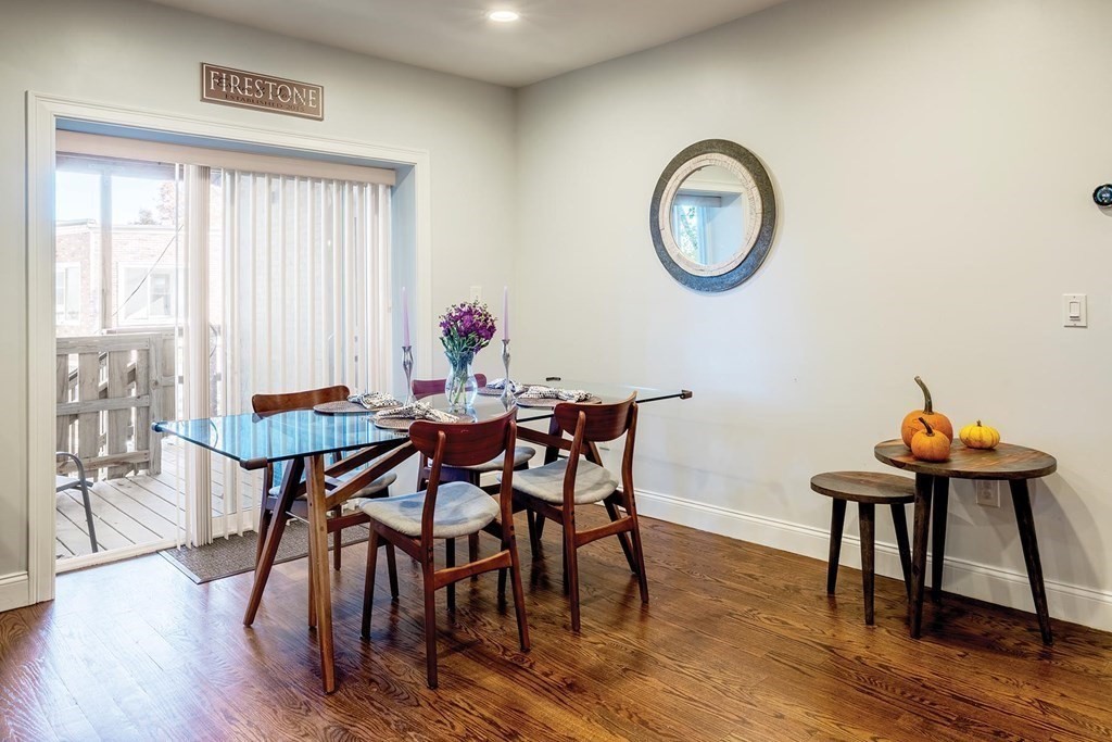 177 Winthrop Road, Unit 1 Brookline, MA 02445 - Photo 4 of 9 a view of a dining room with furniture and wooden floor
