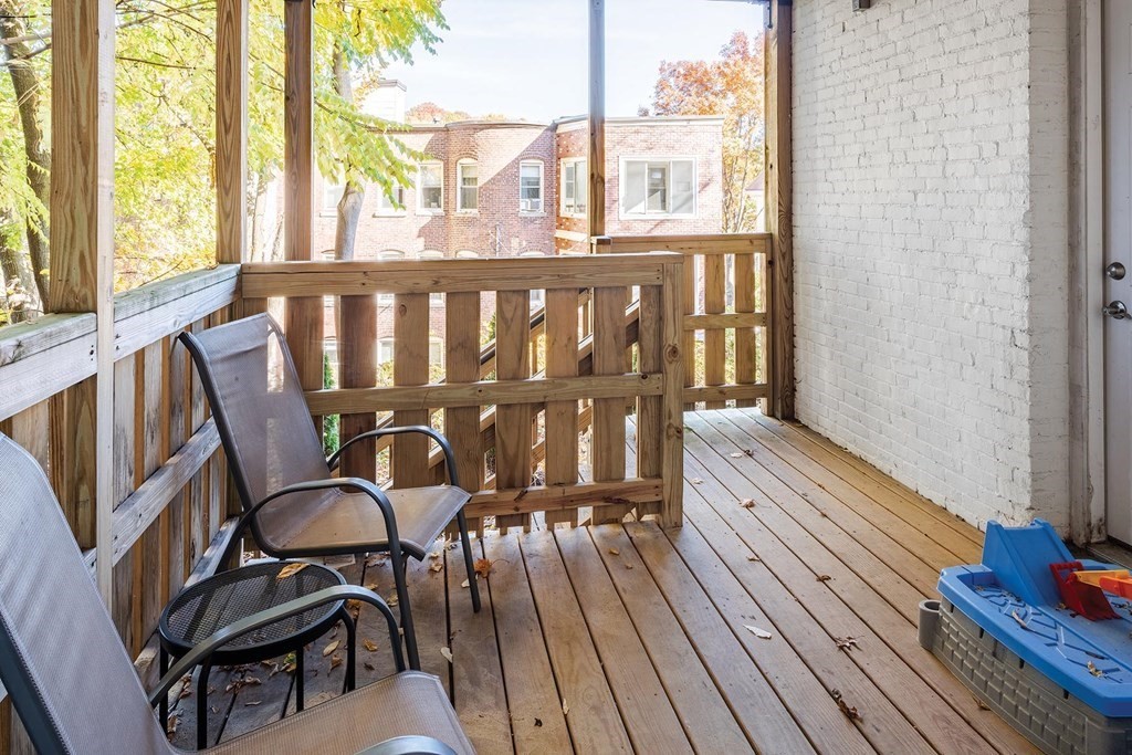 177 Winthrop Road, Unit 1 Brookline, MA 02445 - Photo 8 of 9 a view of a chairs on the balcony