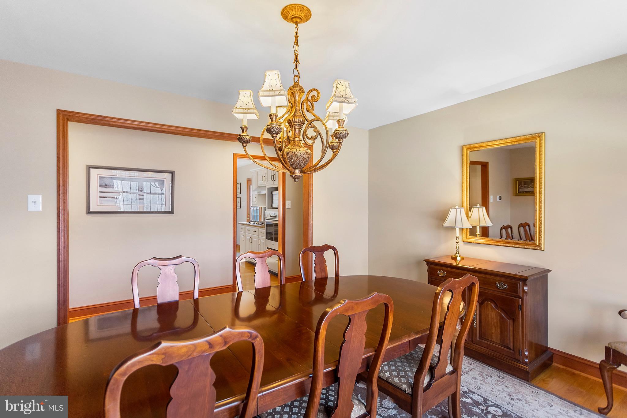 1310 Stackhouse Mill Road Newtown Square, PA 19073 - Photo 15 of 40 a dining room with furniture and chandelier
