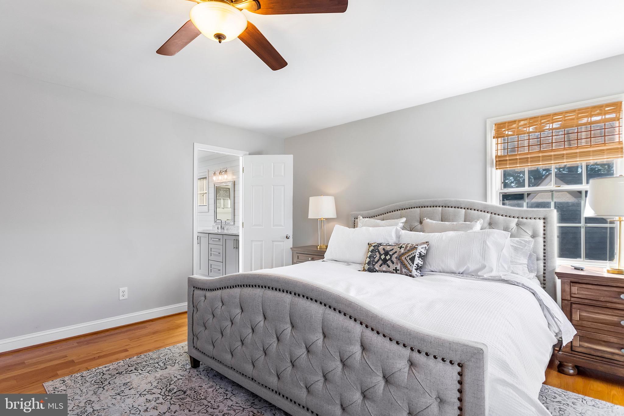 1310 Stackhouse Mill Road Newtown Square, PA 19073 - Photo 20 of 40 a bedroom with a bed and a large window