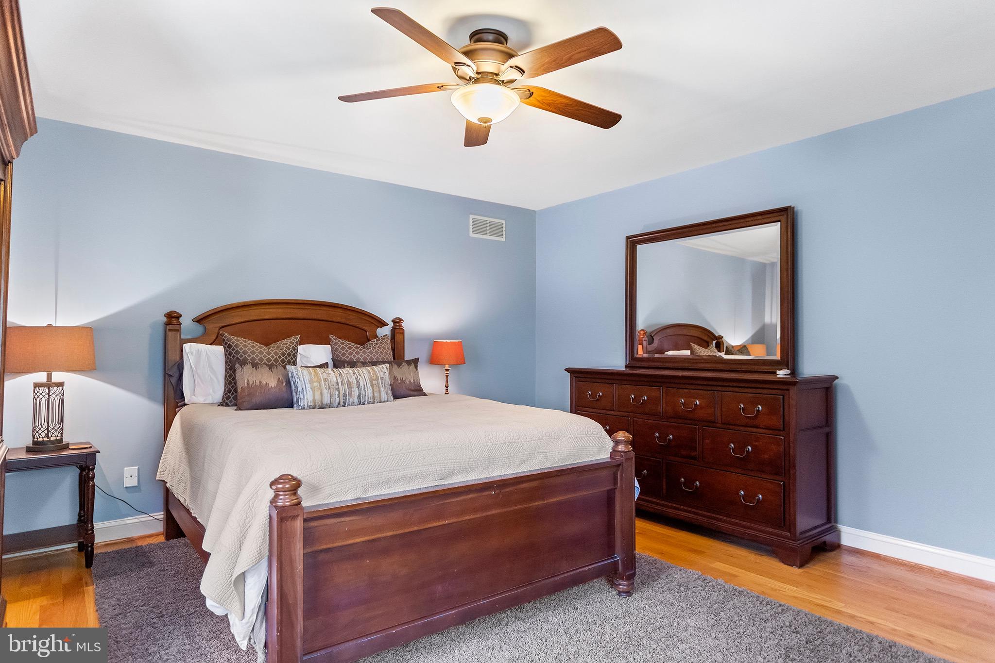 1310 Stackhouse Mill Road Newtown Square, PA 19073 - Photo 25 of 40 a bedroom with a bed and a tv on the dresser