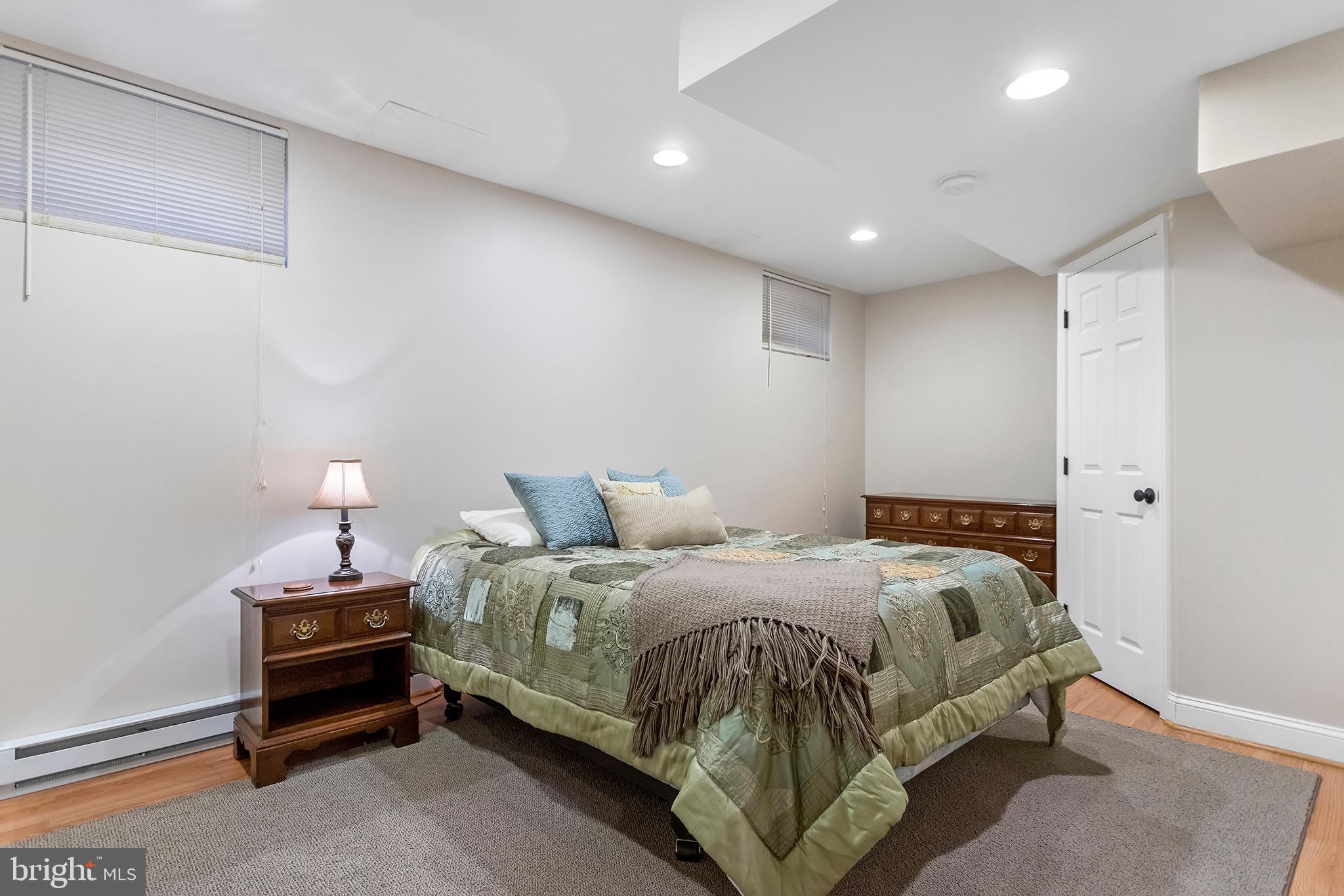 1310 Stackhouse Mill Road Newtown Square, PA 19073 - Photo 33 of 40 a bedroom with a bed and a lamp
