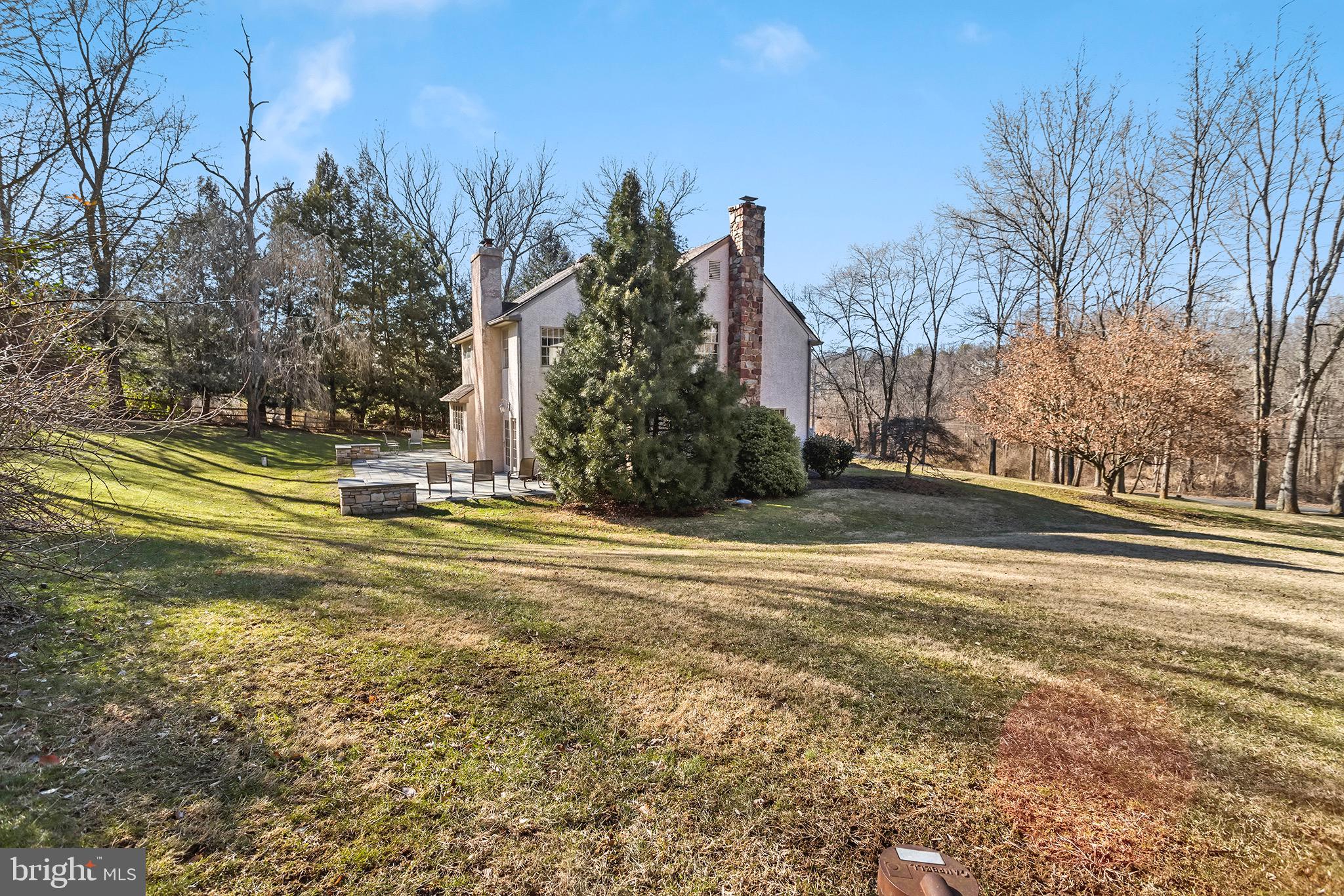 1310 Stackhouse Mill Road Newtown Square, PA 19073 - Photo 37 of 40 a view of a yard with a house in the background