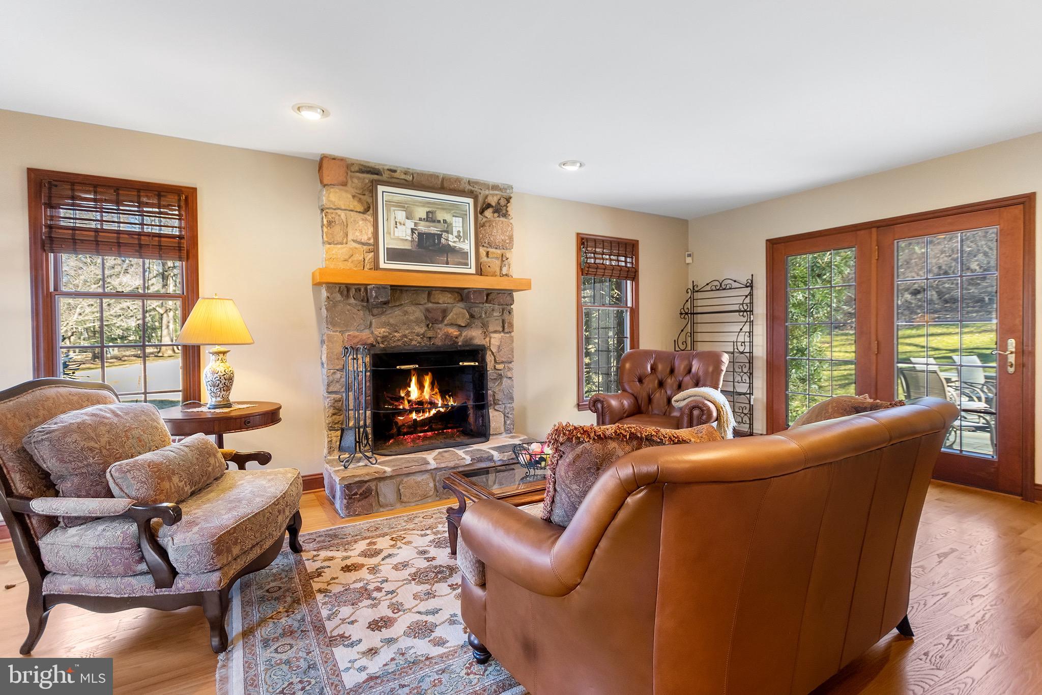 1310 Stackhouse Mill Road Newtown Square, PA 19073 - Photo 4 of 40 a living room with furniture fireplace and a large window