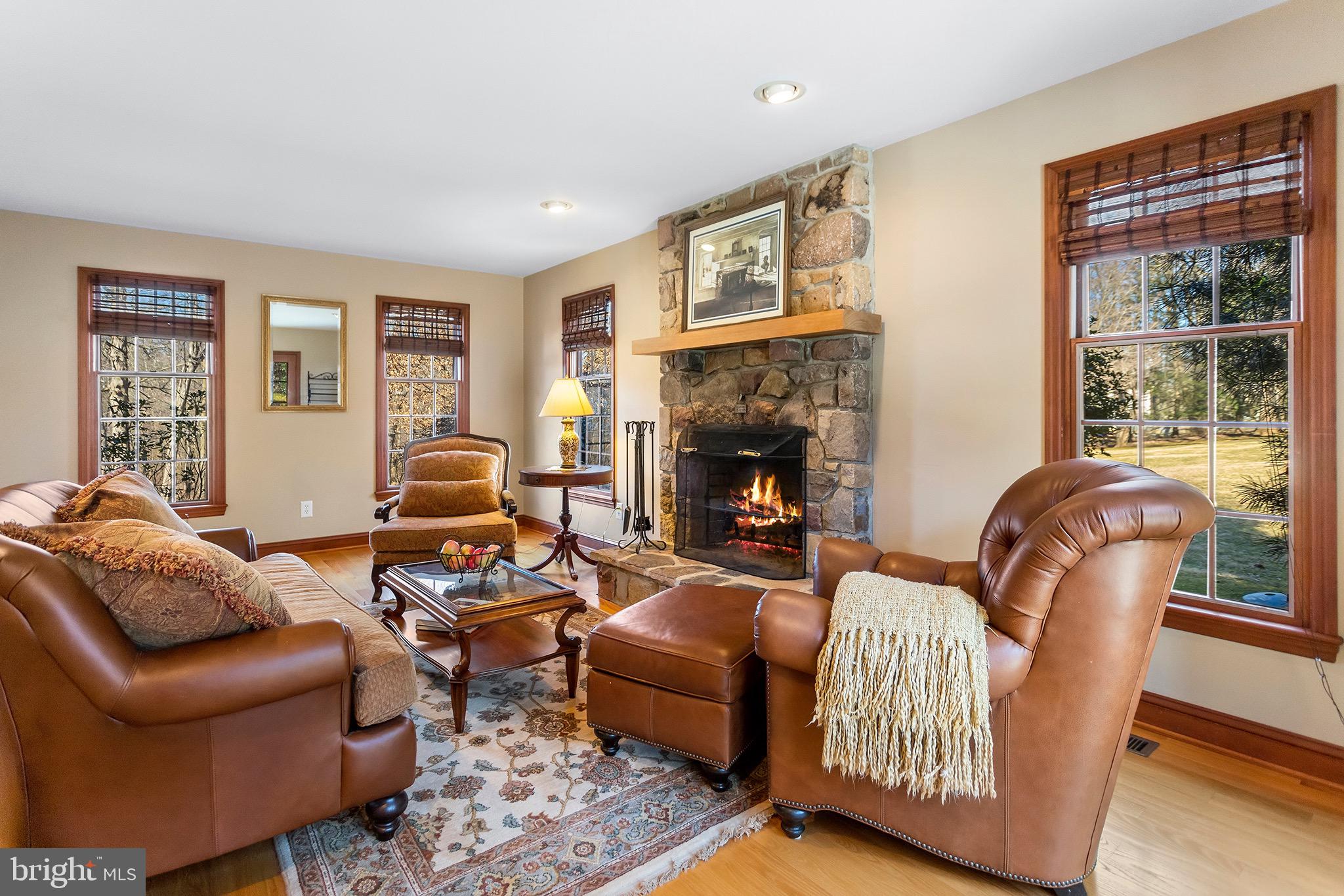 1310 Stackhouse Mill Road Newtown Square, PA 19073 - Photo 5 of 40 a living room with furniture and a fireplace