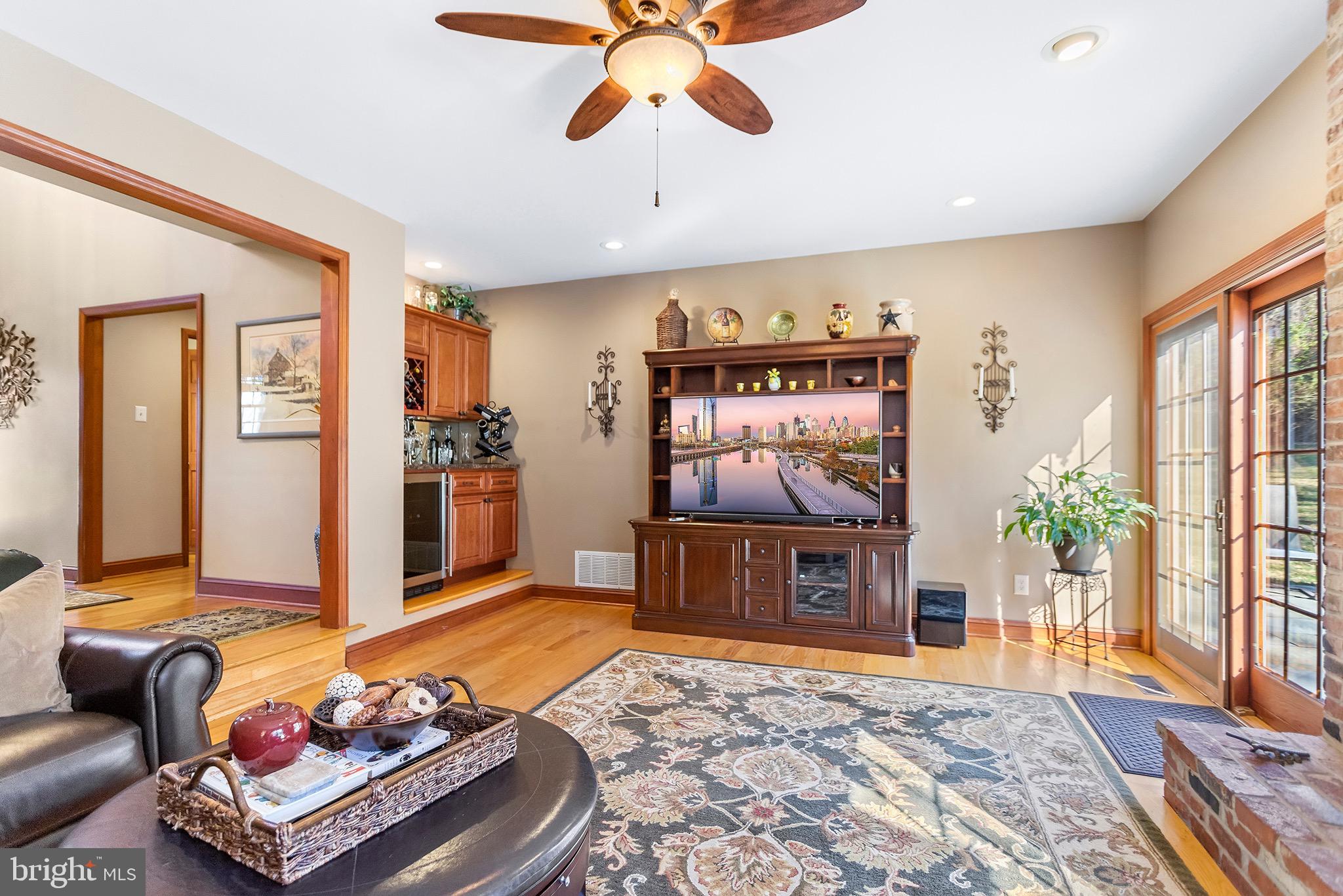 1310 Stackhouse Mill Road Newtown Square, PA 19073 - Photo 9 of 40 a living room with furniture and a flat screen tv