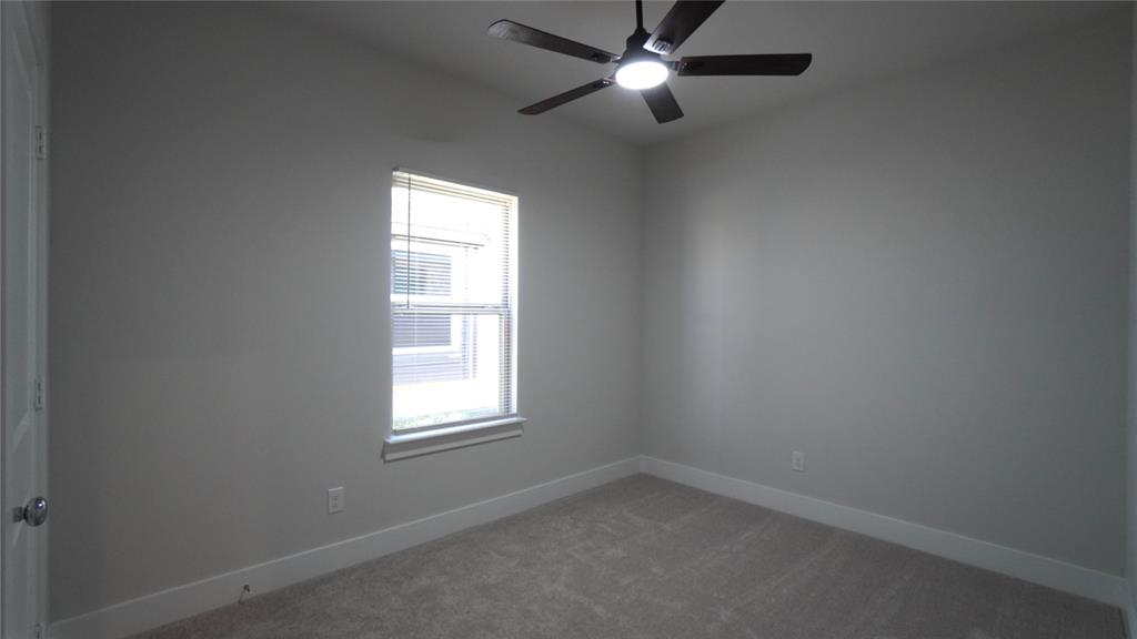 1374 Chisos Way Forney, TX 75126 - Photo 21 of 25 an empty room with a window and a fan