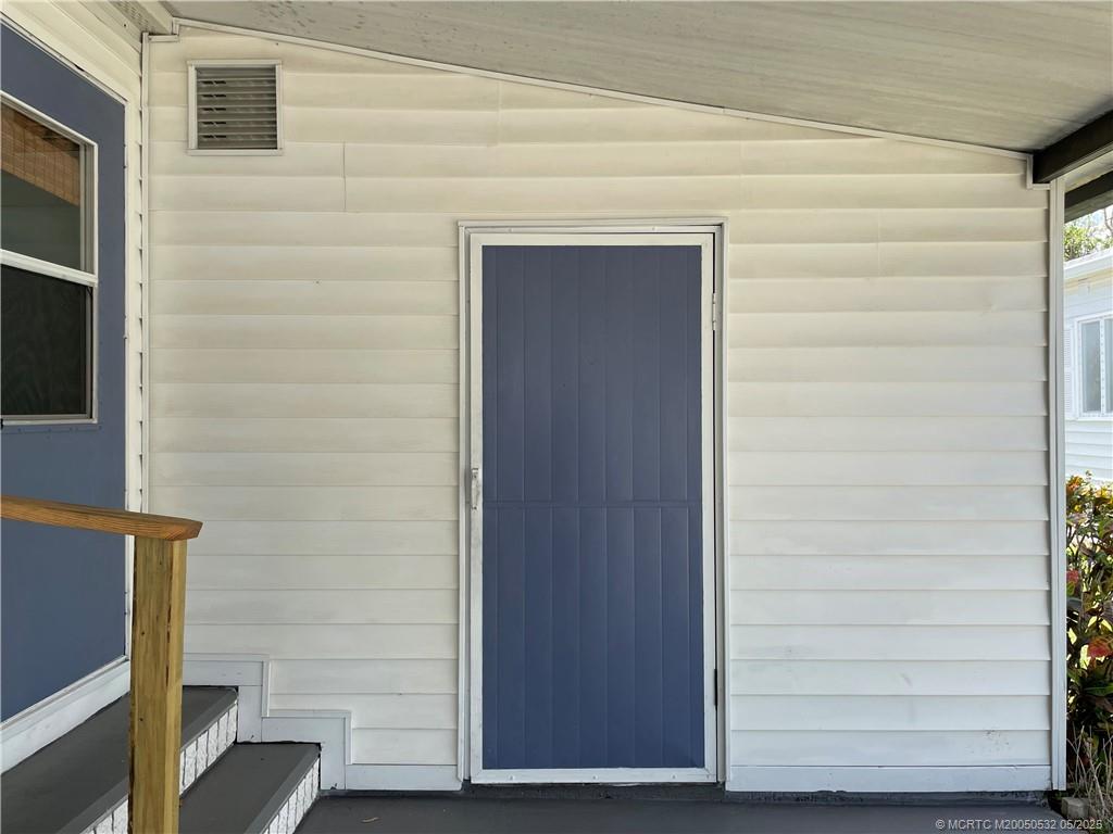16446 Southwest Three Wood Way Indiantown, FL 34956 - Photo 11 of 32 a view of front door