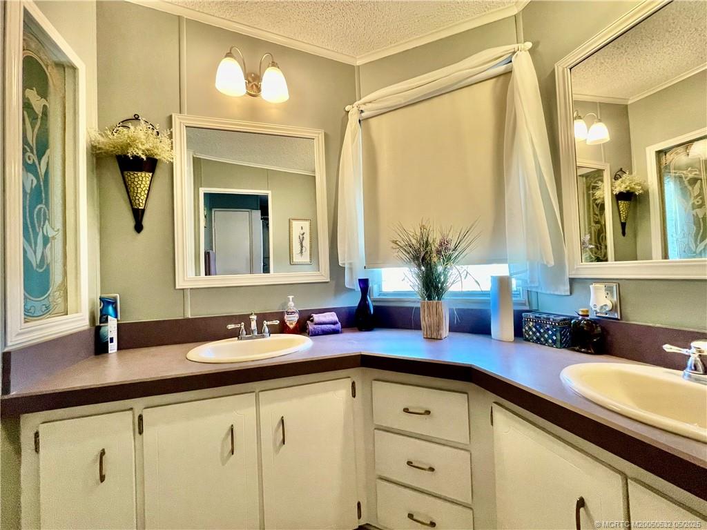 16446 Southwest Three Wood Way Indiantown, FL 34956 - Photo 18 of 32 a bathroom with a granite countertop sink and a mirror