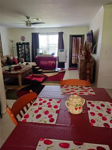 a bedroom with furniture and a flat screen tv