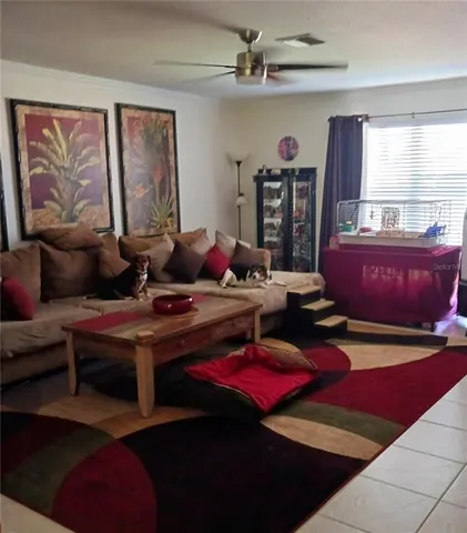 a living room with furniture rug and window
