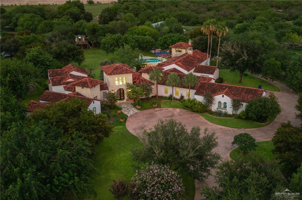an aerial view of a house with garden space and street view