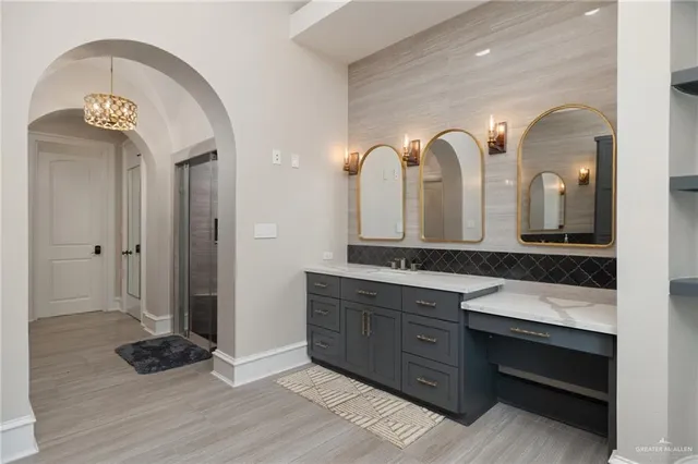 a bathroom with a double vanity sink and a mirror