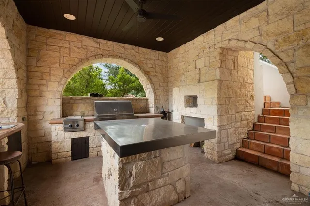 a view of two chairs in a balcony