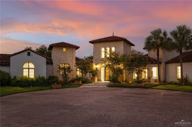 a view of a house next to a yard