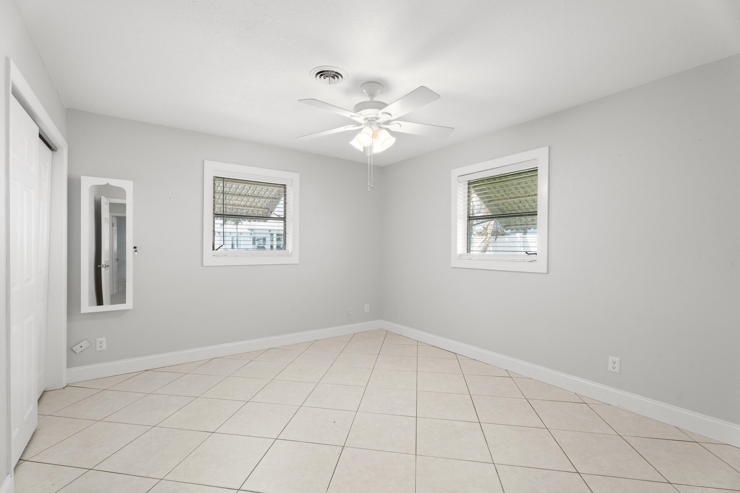 1459 Southwest Seahawk Way Palm City, FL 34990 - Photo 14 of 43 a view of an empty room with a window