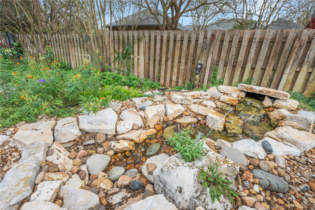 713 Willow Loop College Station, TX 77845 - Photo 36 of 39 a backyard of a house with table and chairs