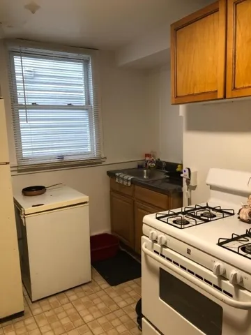 a kitchen with a stove and a microwave