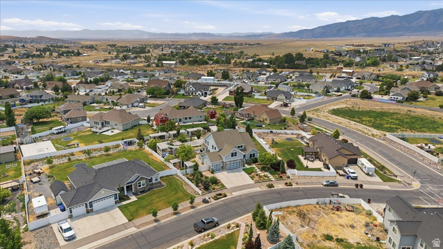 2038 East Ranch Road Eagle Mountain, UT 84005 - Photo 60 of 66 Expansive residential area featuring a variety of single-family homes, mature landscaping, paved roads, and distant mountain ranges