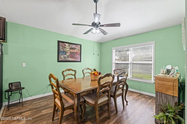 a dining room with furniture and window