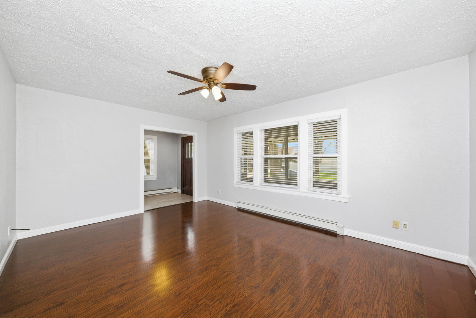 500 Catherine Street Ottawa, IL 61350 - Photo 10 of 23 an empty room with wooden floor and windows
