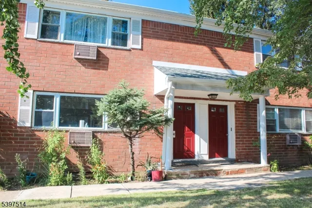 a front view of house with an outdoor space
