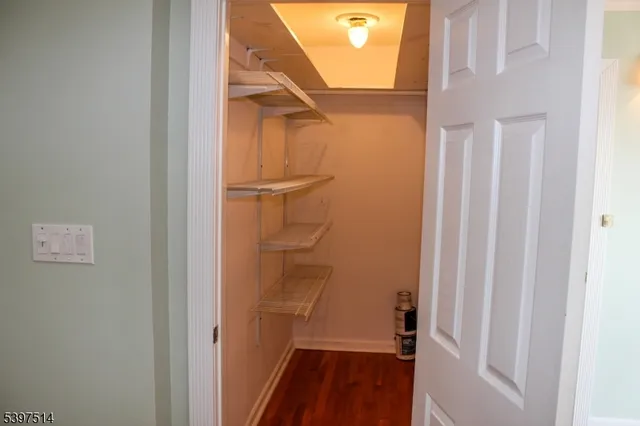 a view of a bathroom from a corridor