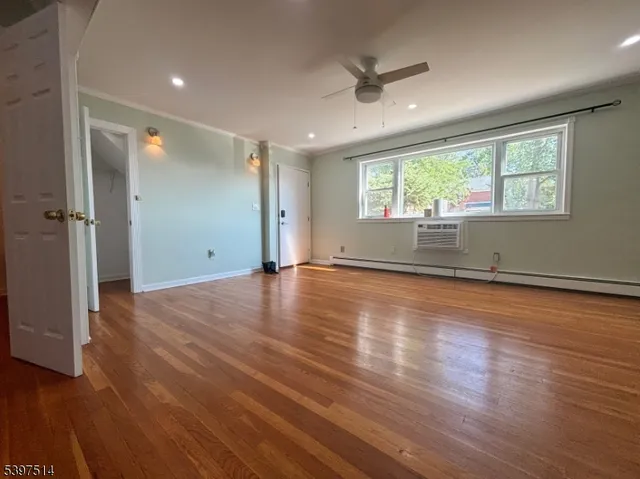 a kitchen with stainless steel appliances granite countertop a refrigerator and a stove