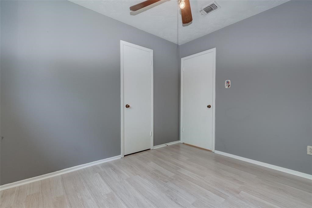7659 Winkle Wood Lane Houston, TX 77086 - Photo 16 of 24 wooden floor in an empty room