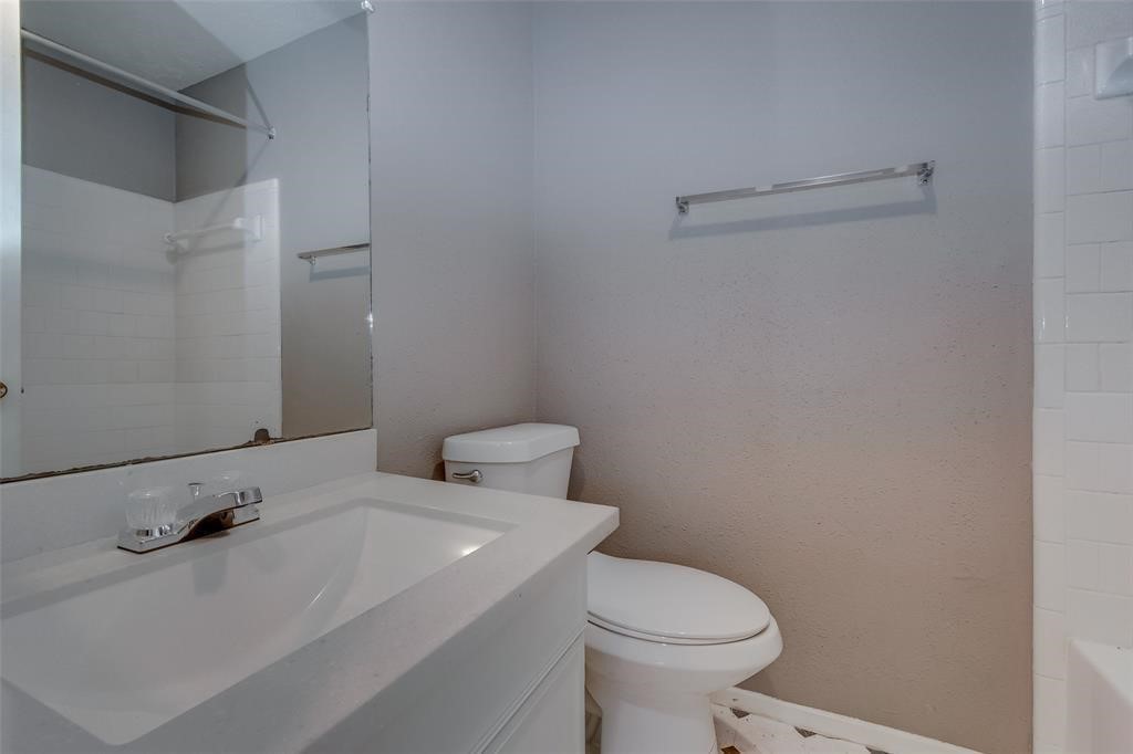 7659 Winkle Wood Lane Houston, TX 77086 - Photo 17 of 24 a bathroom with a sink and a toilet
