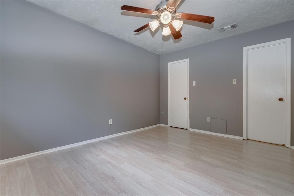 7659 Winkle Wood Lane Houston, TX 77086 - Photo 21 of 24 wooden floor in an empty room