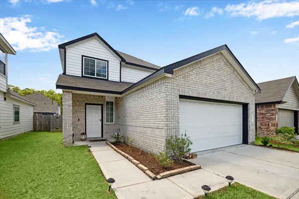 a front view of house with yard