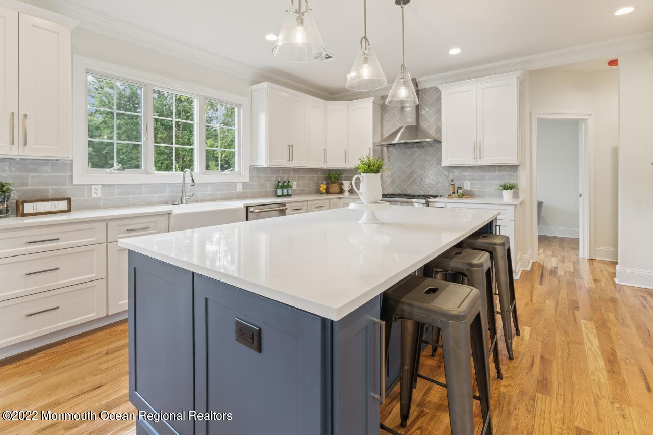 108 Horseneck Point Road Oceanport, NJ 07757 - Photo 11 of 37 a kitchen with a stove a sink a center island and cabinets