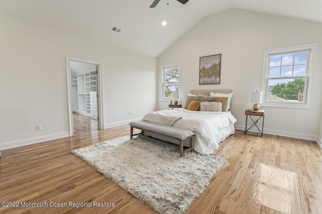 108 Horseneck Point Road Oceanport, NJ 07757 - Photo 22 of 37 a bedroom with a bed and a night stand