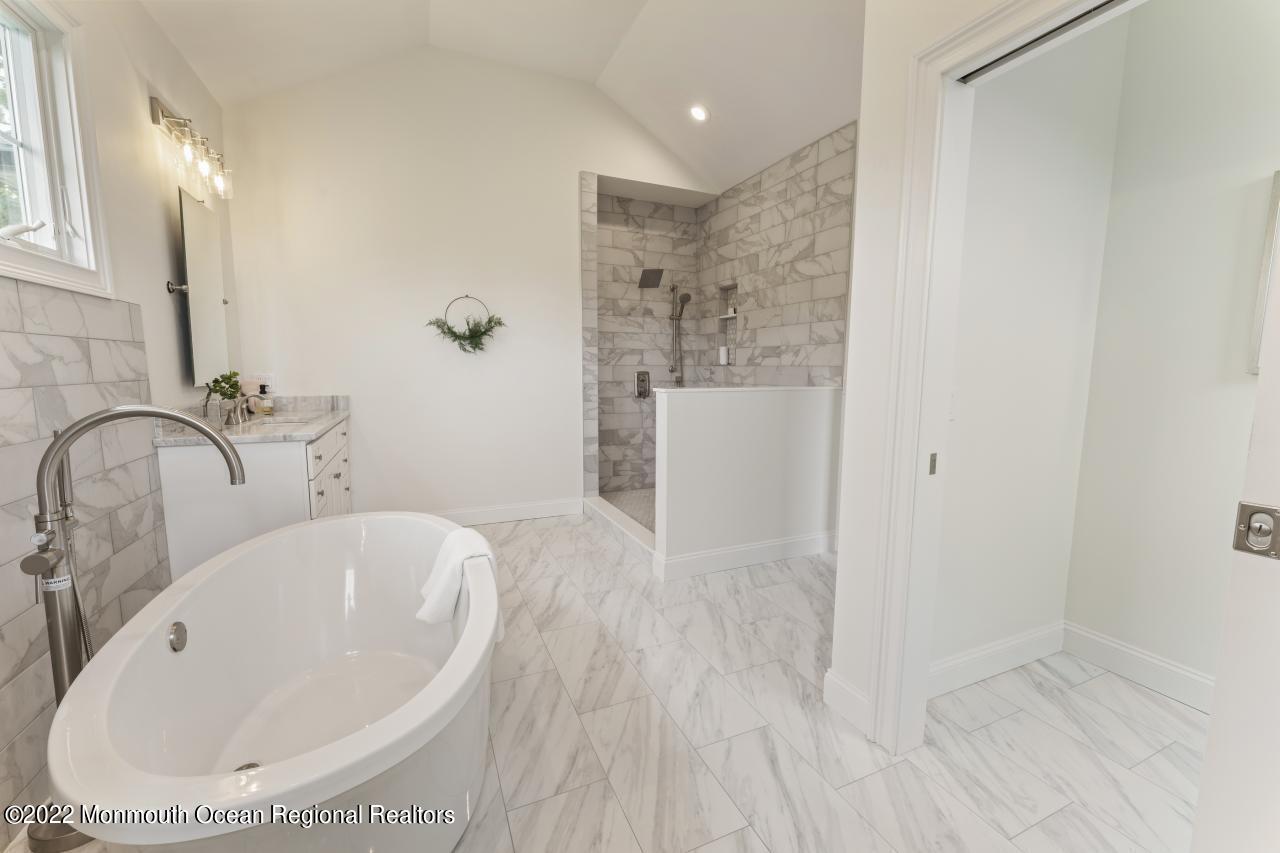 108 Horseneck Point Road Oceanport, NJ 07757 - Photo 27 of 37 a bathroom with a bathtub and shower