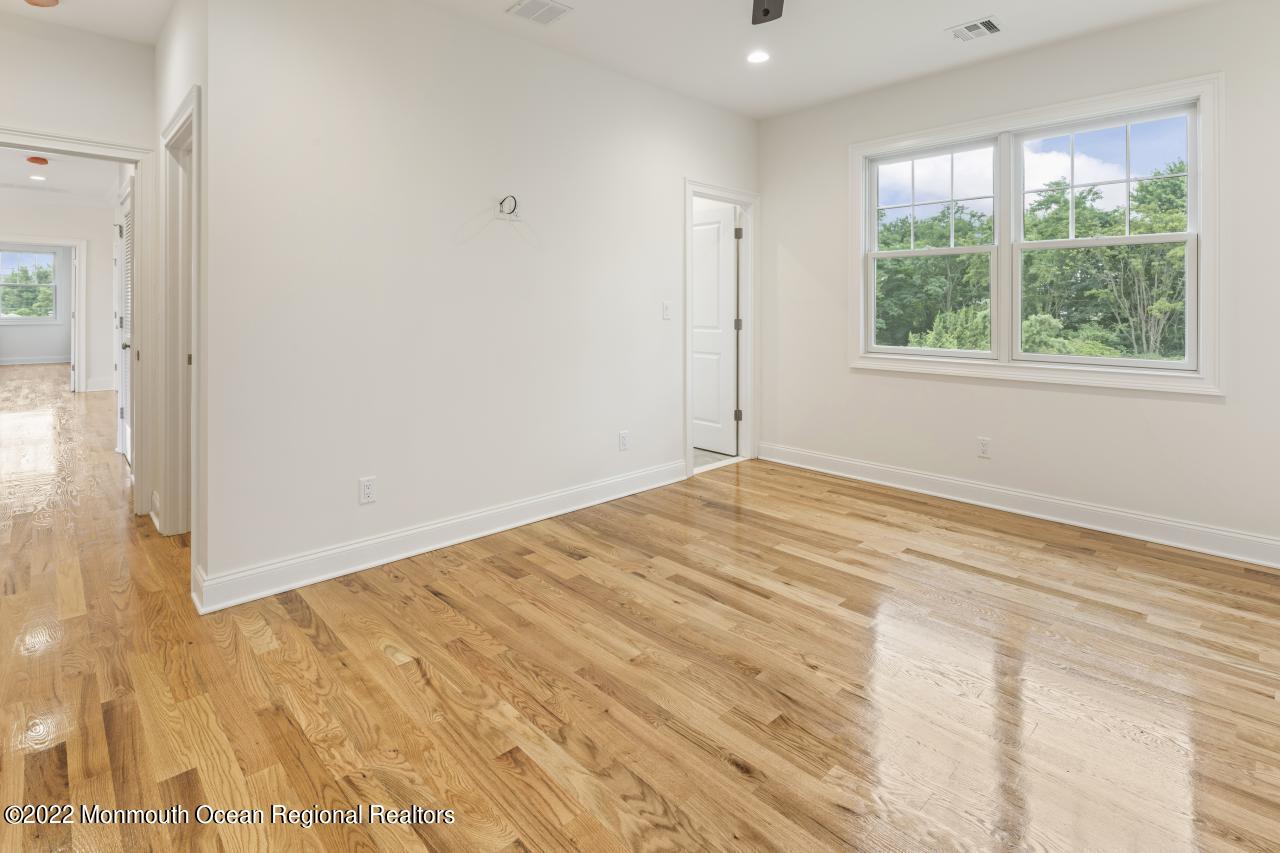 108 Horseneck Point Road Oceanport, NJ 07757 - Photo 29 of 37 a view of empty room with wooden floor and fan