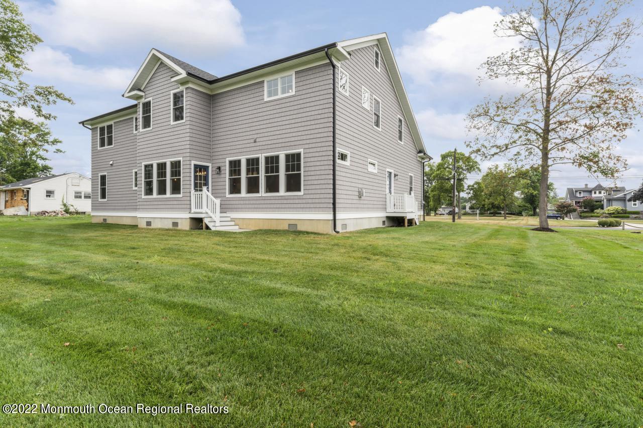 108 Horseneck Point Road Oceanport, NJ 07757 - Photo 4 of 37 a big house with a big yard and more trees
