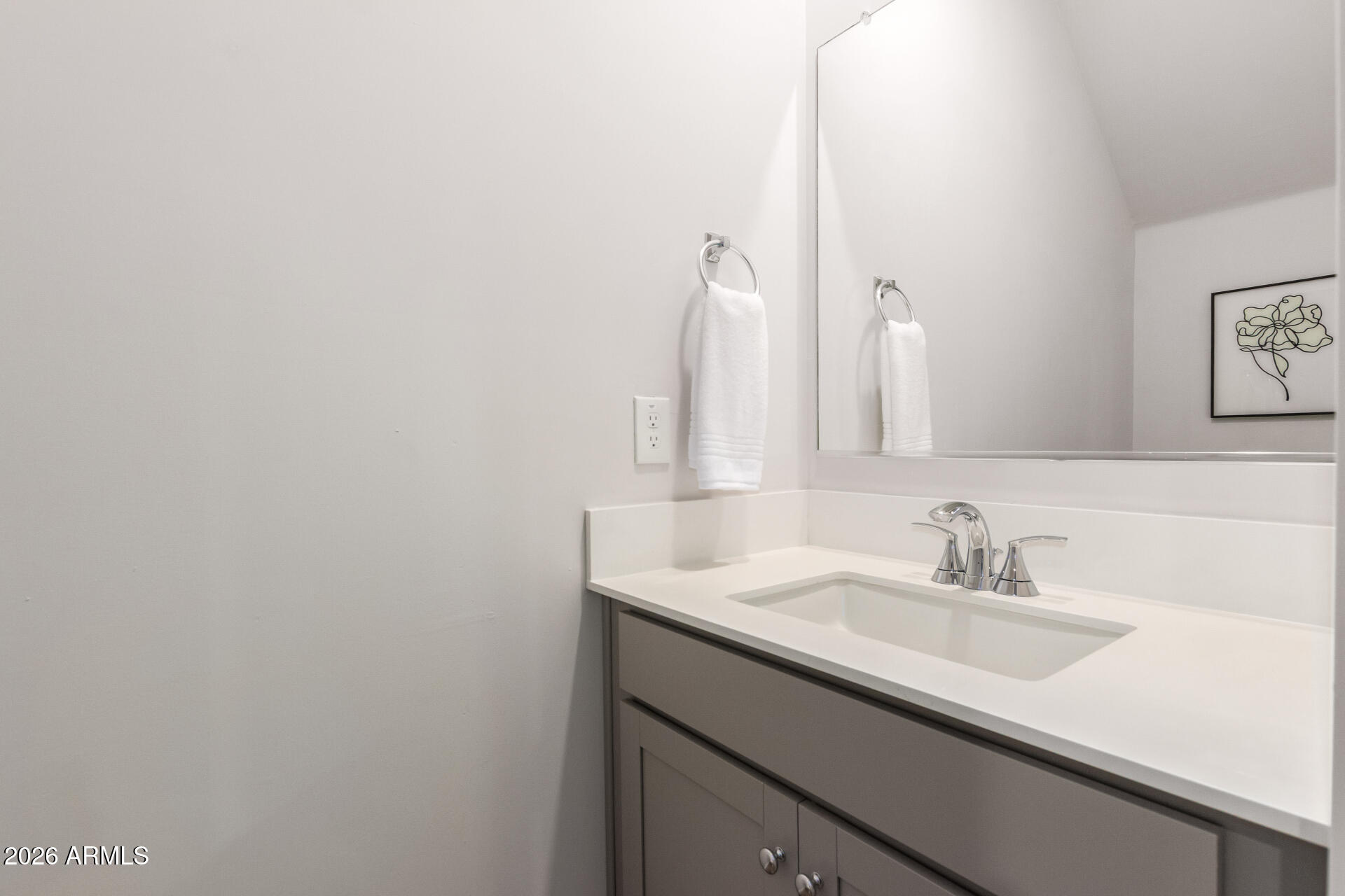 7576 West Darrow Street Laveen, AZ 85339 - Photo 13 of 44 a bathroom with a sink and a mirror