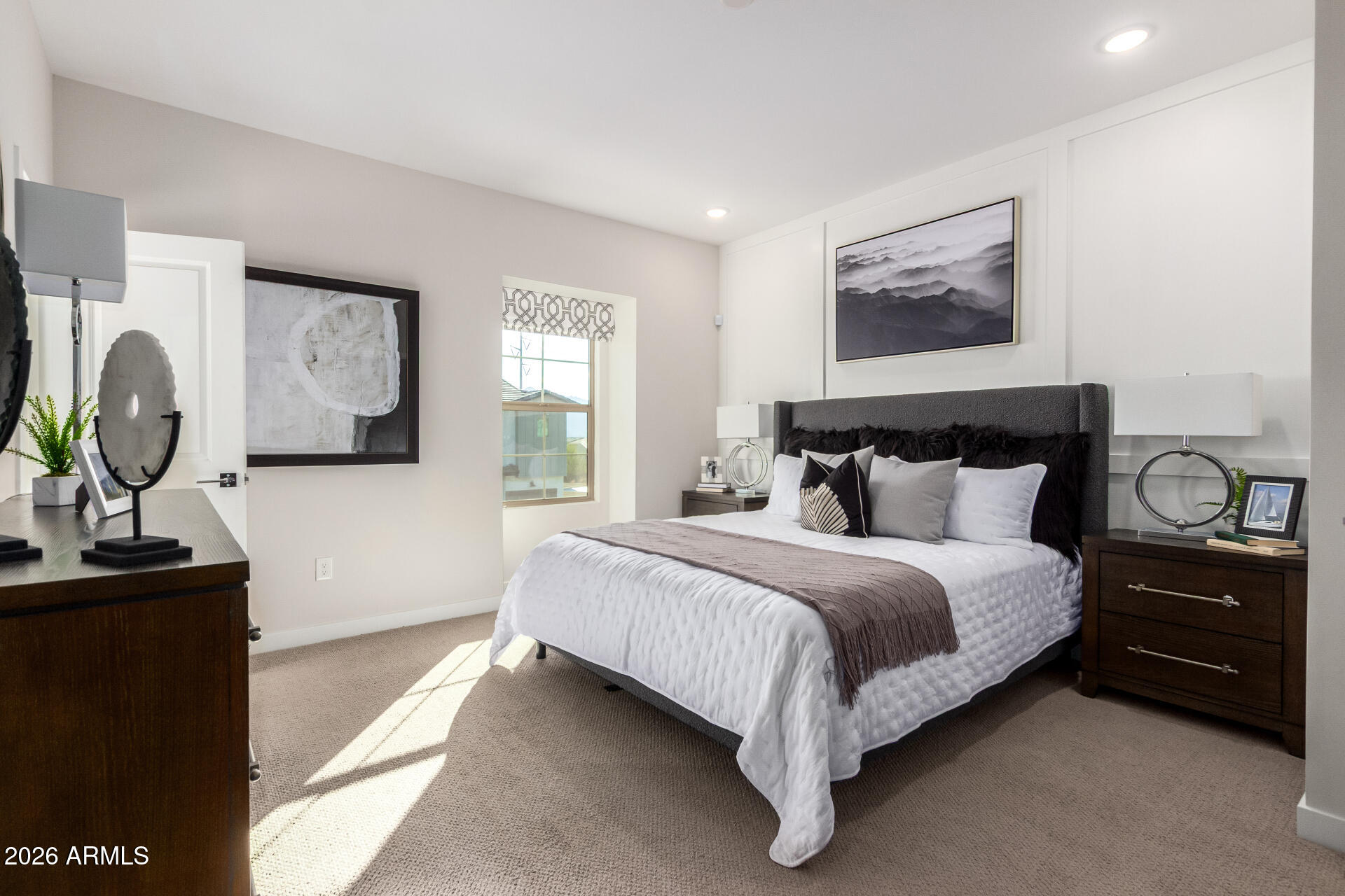 7576 West Darrow Street Laveen, AZ 85339 - Photo 14 of 44 a bedroom with bed and a painting on the wall